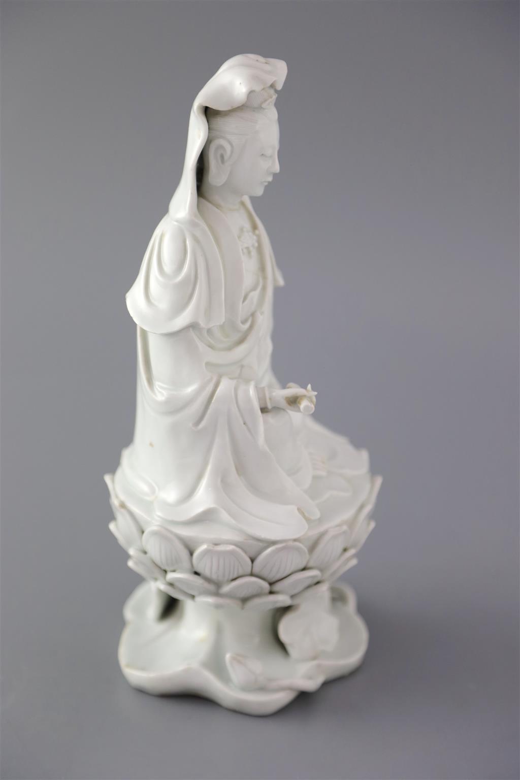 A Chinese Dehua blanc de chine seated figure of Guanyin, 18th/19th century, 25cm high